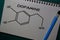 Dopamine write on a book. Structural chemical formula. Education concept