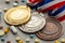 Doping for athletes. Gold, silver and bronze medal and pills with capsules on a gray background