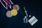 Doping in sport, concept photo. Medal set, drugs, Medicine bottle for injection medical glass vials