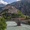The Dora Baltea river flows under the hill of Bard`s Fort, Valle d`Aosta, Italy