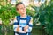 dorable caucasian student boy smiling happy standing at the park