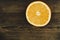 Dorange slices on an orange wooden background. Top view