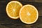 Dorange slices on an orange wooden background. Top view