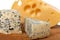 Dorblu and other cheeses on wooden board