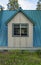 A dormer on the first floor of a cottage with a standing seam metal roof