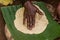 Dorze woman is preparing kocho bread made of enset & x28;false banana& x29;, important source of food, Ethiop