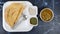 Dosa, Thin Pancake or crepe, is a South Indian meal served with sambhar and coconut chutney, Sauce