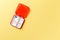 Dose pill box with medical pills on yellow background. Top view. Flat lay. Copy space