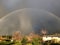 Double beautiful rainbow on countryside on blooming at springtim