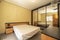 Double bedroom with plywood furniture and wardrobe with sliding mirro