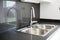 A double bowl stainless steel kitchen sink in a modern design