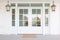 double central door, glass panels, white colonial, lampposts