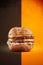 Double cheese burger with crispy bun in a colorful background - Isolated