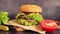 Double cheeseburger on a wooden cutting board, side view. Fast food