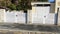 Double classic white aluminum home gate portal of suburbs house door in city