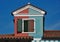 Double-colored mansard roof dormer in Burano, Italy