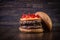 Double craft beef burger with cheddar cheese, caramelized onion.and pepper pout on wood table and rustic background