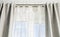 Double curtain rods for see through day curtain and room darkening night curtains.