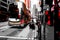 Double-decker bus and a man with a trolley on the road in Hong Kong