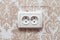 Double electric european socket on the wall with wallpaper