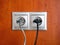Double electric socket with plugs