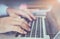 Double exposure of businessman hand working laptop on wooden desk in office in morning light.