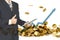 Double exposure of businessman using tablet to manage his business and give thumbs up on falling gold coins background.