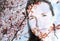 Double exposure image of a young woman and spring flowers