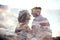 Double exposure man and woman couple hugging with mountains in background. Mountains inside couple in love. Lovers look at each