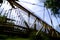 Double exposure of a modern suspension bridge against a blue sky