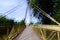 Double exposure of a modern suspension bridge against a blue sky  2