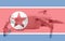 Double exposure of North Korea flag and quadcopter drone aerial camera