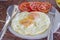 Double fried egg with tomato