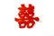 A `double happiness` symbol in chinese characters made with red roses
