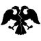 Double-headed eagle with spread wings. Crack on the torso. Destruction and disintegration of the empire. Emblem, symbol.
