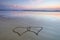 Double heart shape on the beach