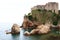 Double kayaks on the Adriatic water, near the coastline of Dubrovnik.