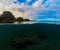 Double landscape with sea and sky. Above and below waterline in tropical seashore.