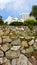 Double level of marble stone wall of resort on the hill