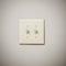 Double Lightswitch on White Wall