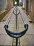 A double metal handrail up a steep pedestrian granite-flagged footpath between buildings in Lerwick, Shetland, UK