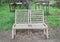 Double outdoor wooden chairs in garden