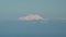 Double Peak Cone Shaped Snowy Elbrus Mountain Summit From Long Distance Zoom
