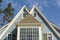 Double-peaked roof of blue family home