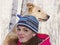 Double portrait of a young girl with a dog in a birch grove.