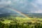 Double Rainbow Over Countryside with a Storm background. Ruteng, Manggarai Regency, Flores, East Nusa Tenggara, Indonesia