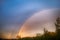 Double rainbow over forest