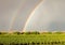 Double rainbow over vineyard