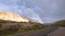 Double Rainbow over winding road to Mammoth Hot Springs in Yellowstone National Park in Wyoming USA