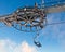 Double ski lift and the wheel with blue sky